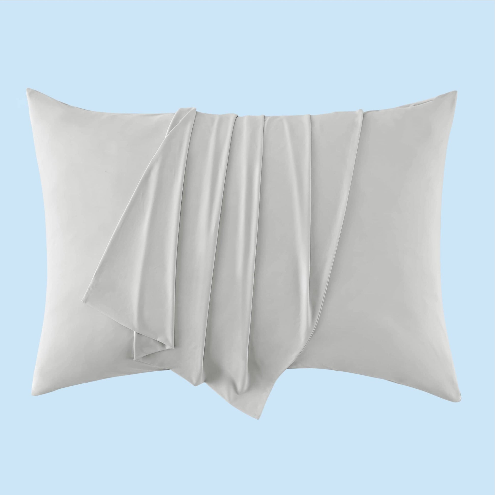 GentleSoft Cooling Pillowcase in light gray, showcasing silky smooth texture on a pillow.