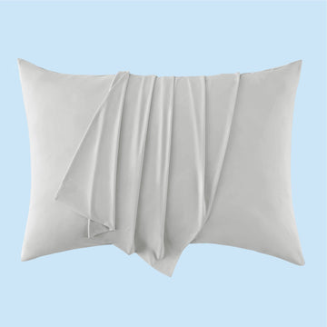 GentleSoft Cooling Pillowcase in light gray, showcasing silky smooth texture on a pillow.
