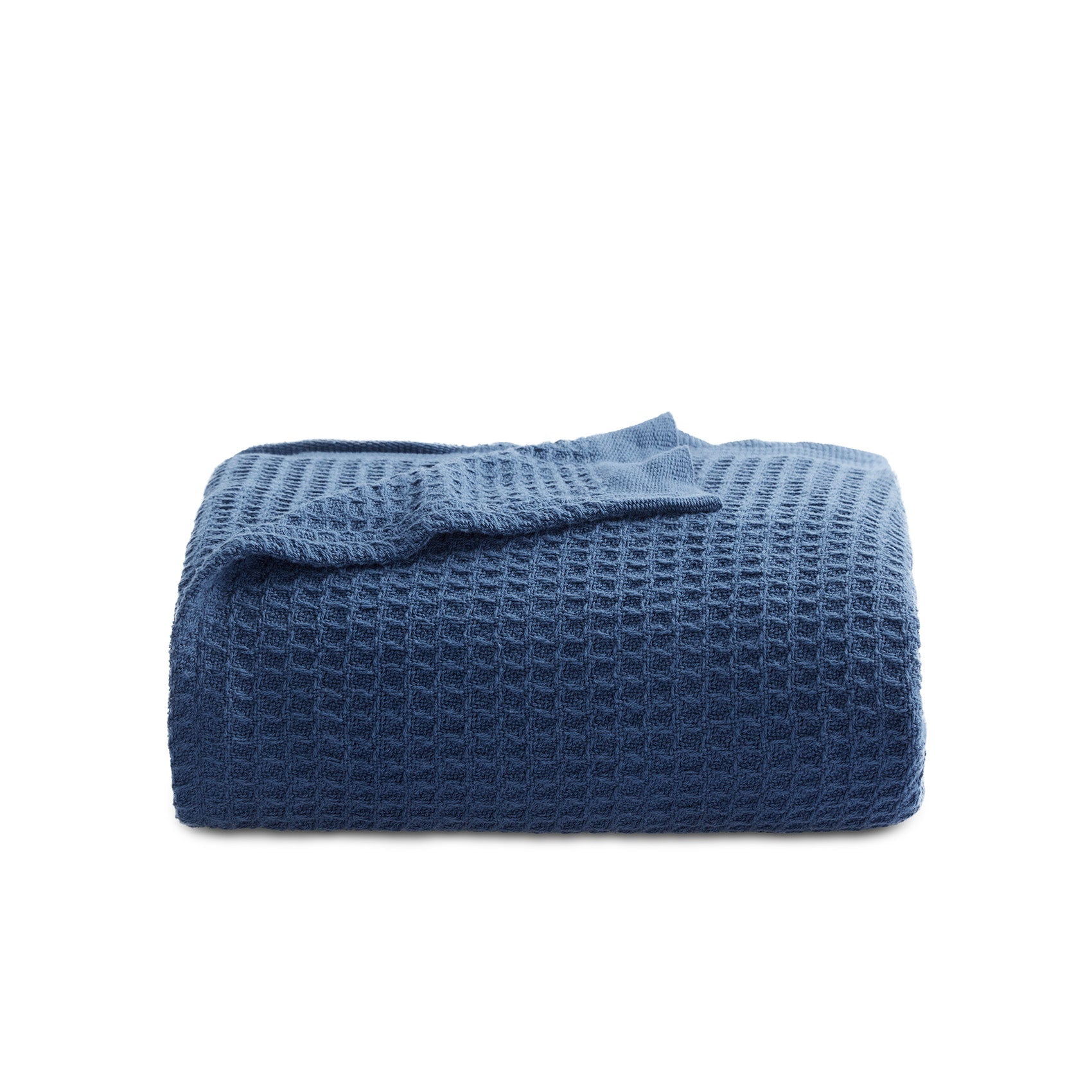 GentleSoft Cotton Waffle Weave Blanket in deep blue, showcasing its soft texture and 3D grid pattern.
