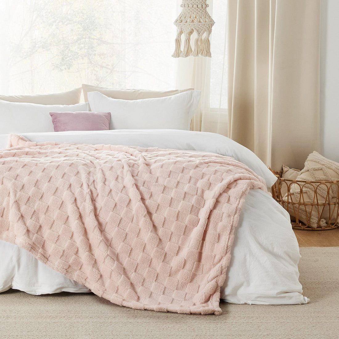 GentleSoft Jacquard Sherpa Blanket in light pink, folded to show plush texture and checkerboard weave.