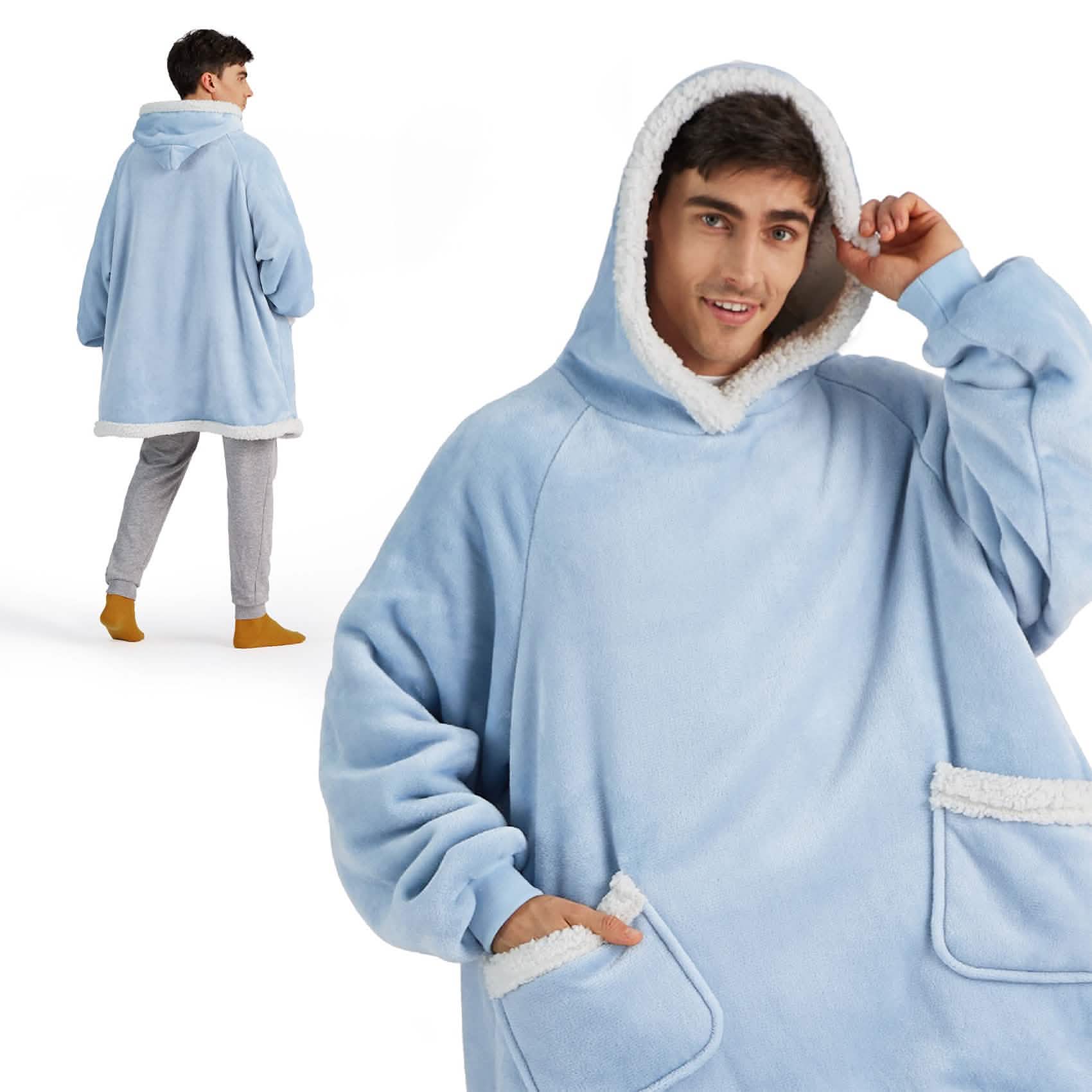Light blue GentleSoft Sherpa Fleece wearable blanket with white trim on hood and pockets on a model.