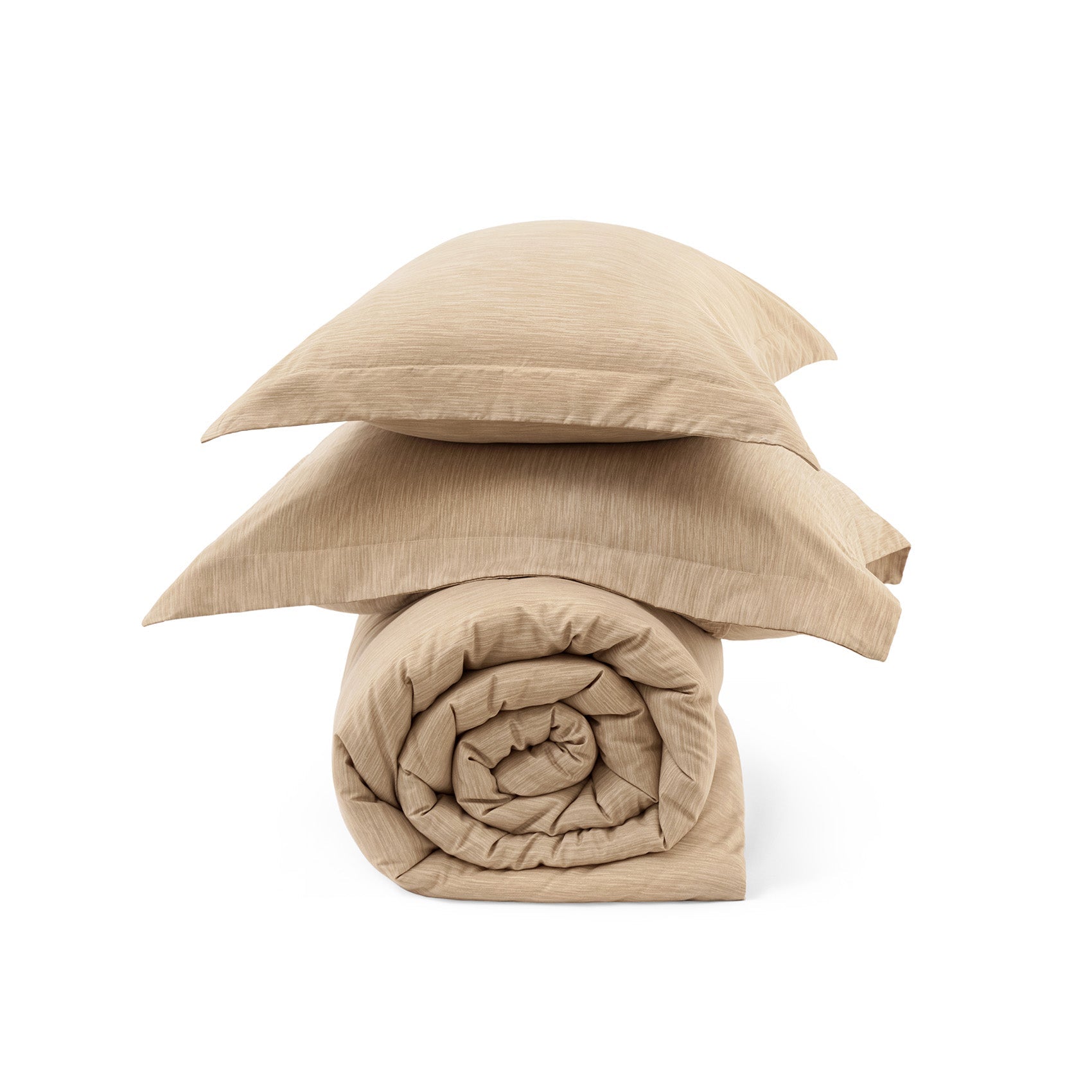 Rolled beige GentleSoft comforter and two pillow shams with subtle dual-tone texture, showcasing cationic dye fabric.