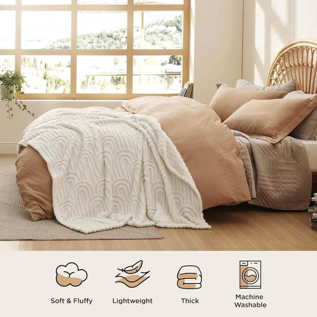 GentleSoft Arch Sherpa Fleece Blanket draped on a cream sofa with embossed arch pattern, showcasing plush texture and style.