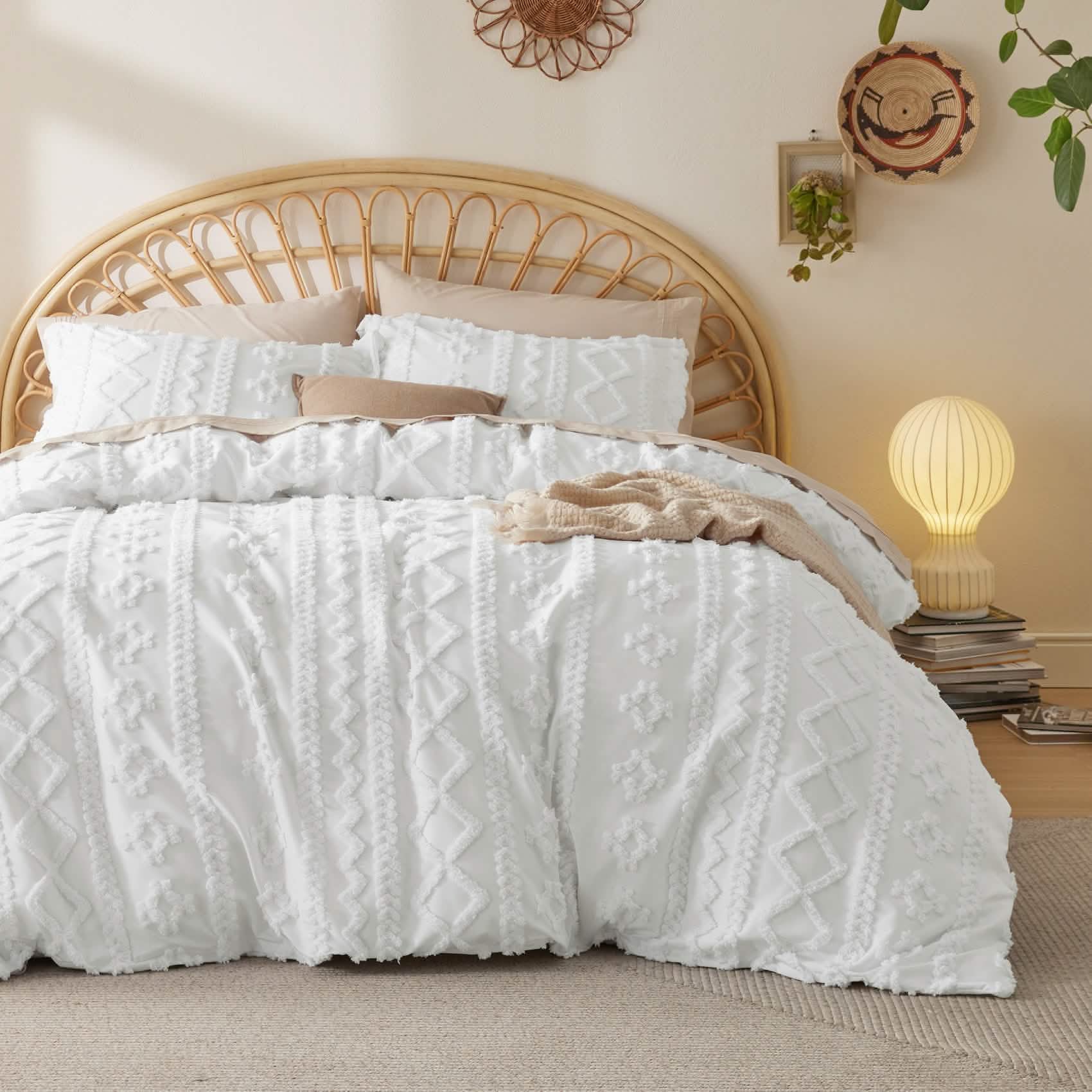 White boho tufted duvet cover set with geometric pattern on a bed with rattan headboard. Soft microfiber bedding.