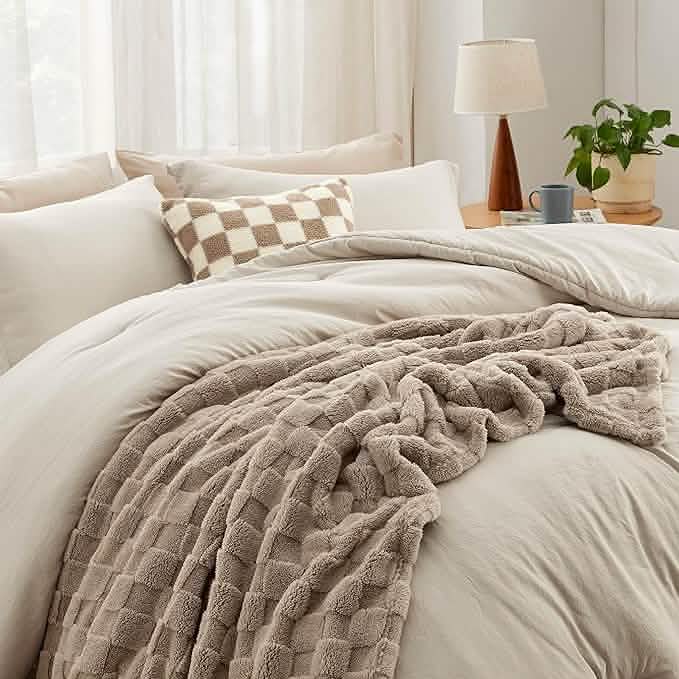 GentleSoft taupe checkered comforter set with plush throw blanket and decorative pillow on a bed.