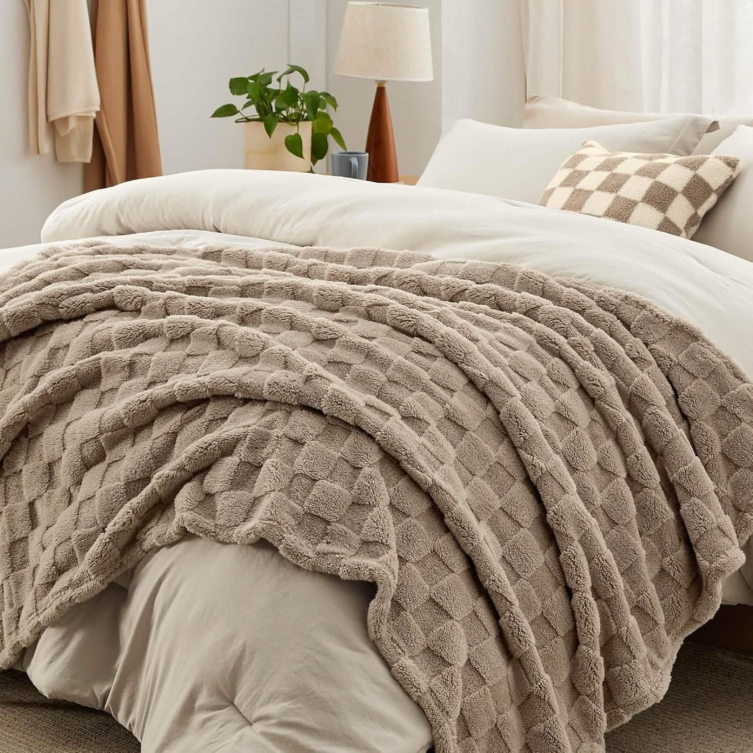 GentleSoft taupe checkered comforter set with plush throw blanket and decorative pillow on a bed.