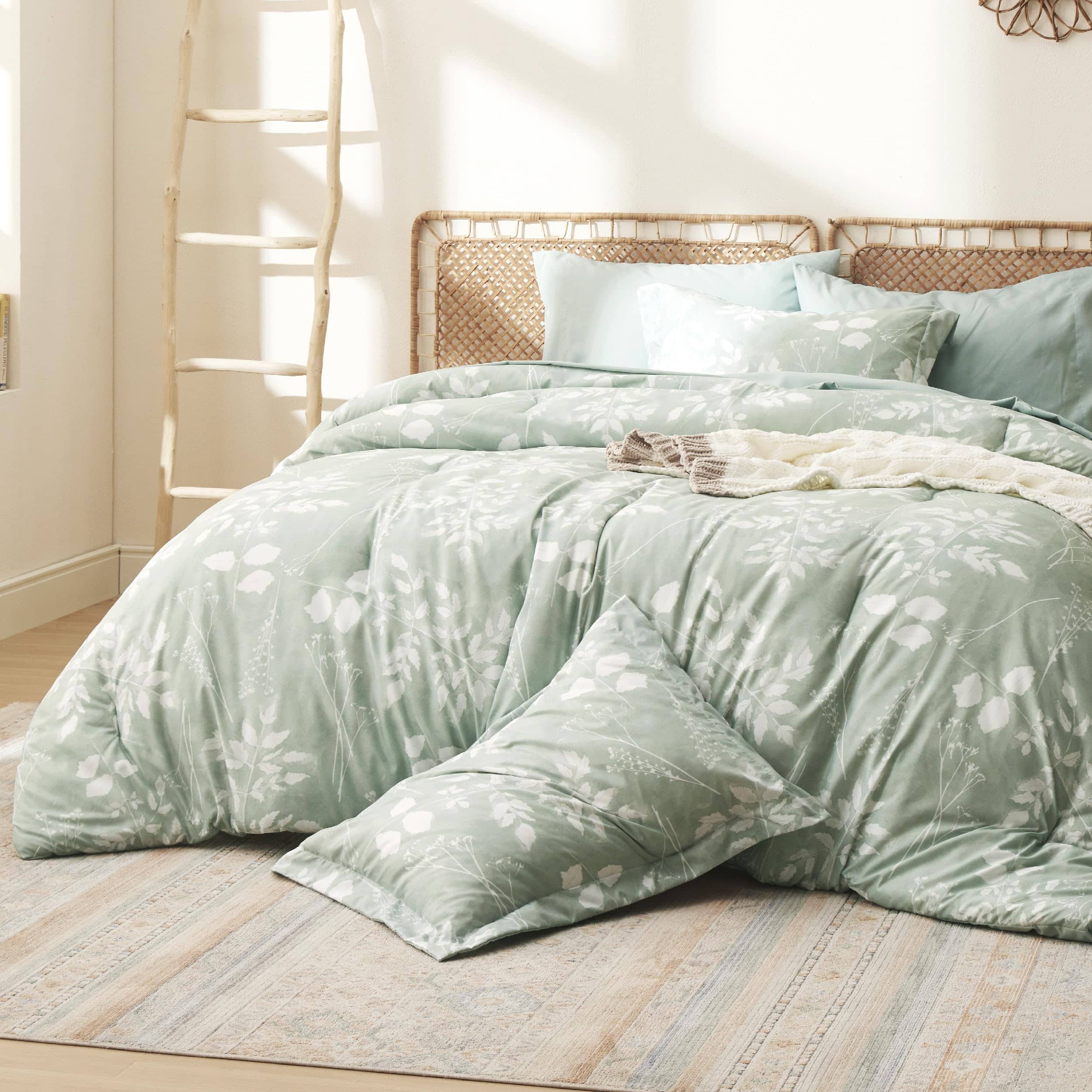 GentleSoft Elegant Floral Comforter Set in mint green with white botanicals, styled on a bed with matching shams.
