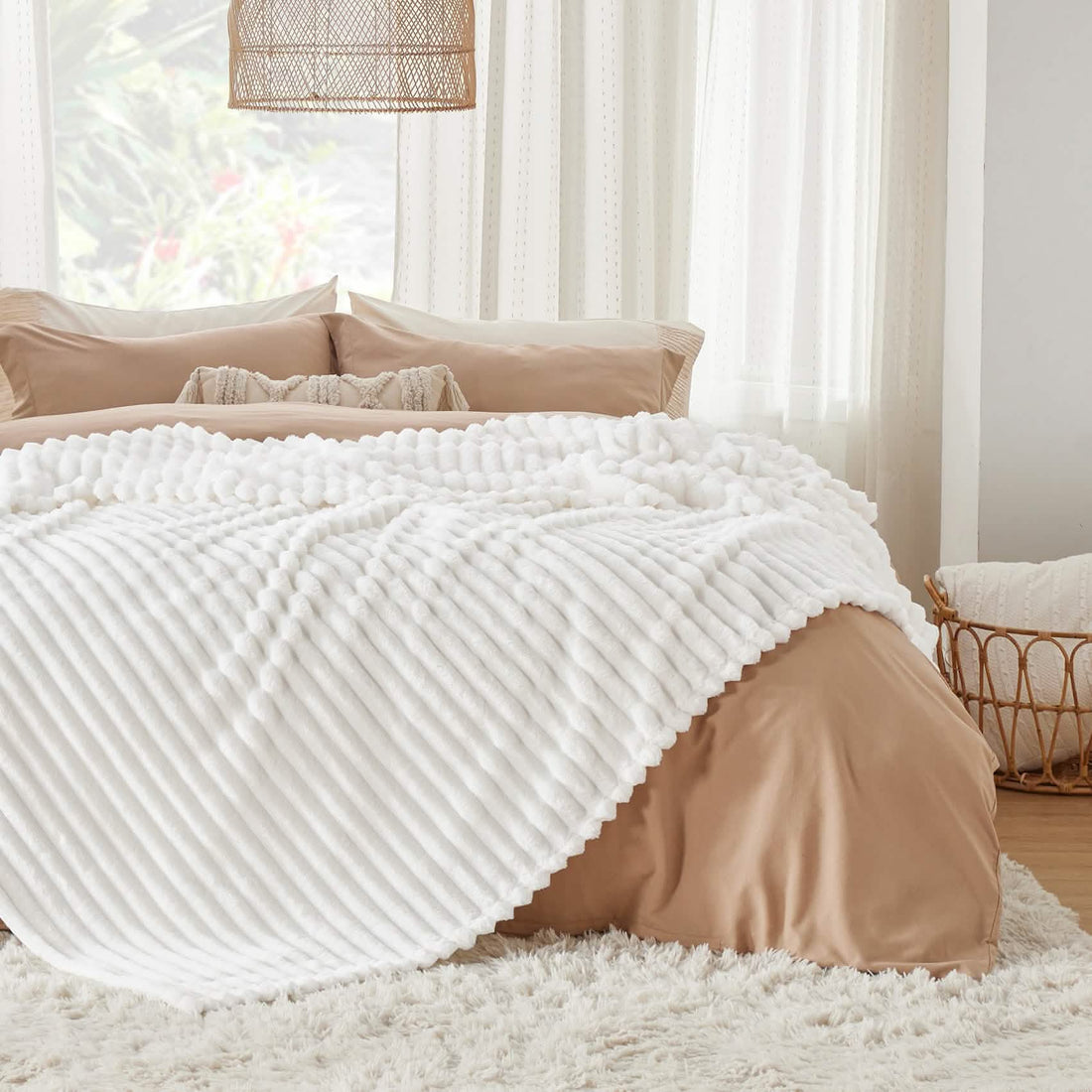 GentleSoft white polyester blanket folded, showing ribbed texture and scalloped edge. Cozy, soft, and lint-free.
